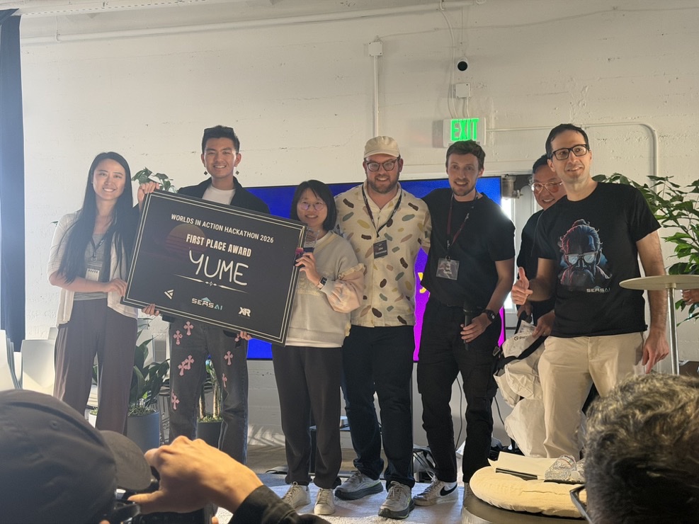 Yume team receiving the first-place Film and Simulation award at Worlds in Action